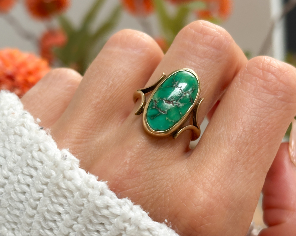 antique turquoise ring in 9ct gold for sale in Leeds, UK, shown on woman's finger