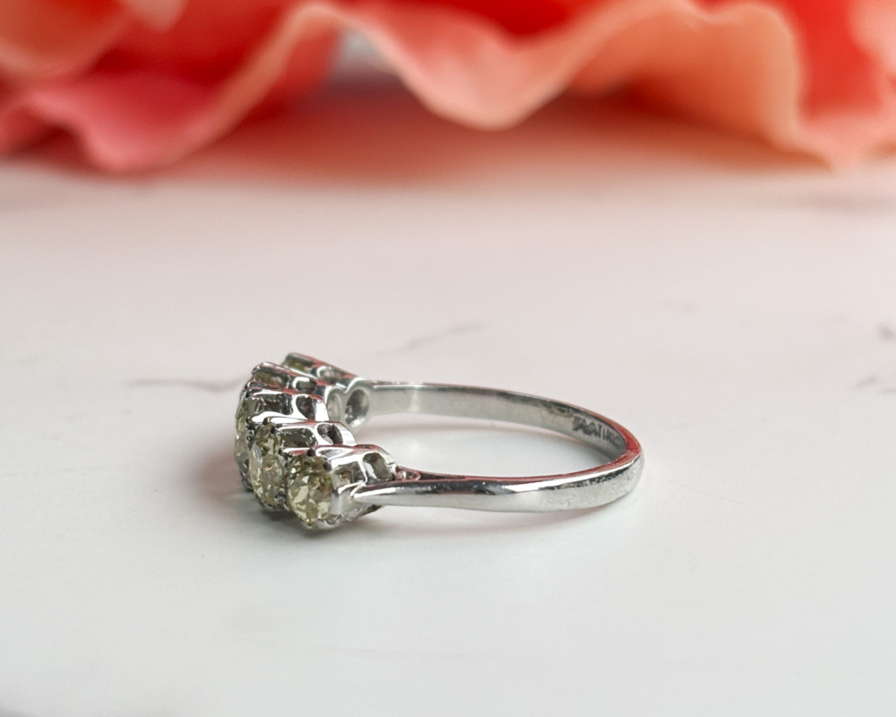antique yellow diamond five stone ring in platinum for sale in Leeds, UK, showing side view of the ring