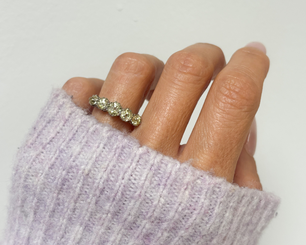 antique yellow diamond five stone ring in platinum for sale in Leeds, UK, shown on woman's hand