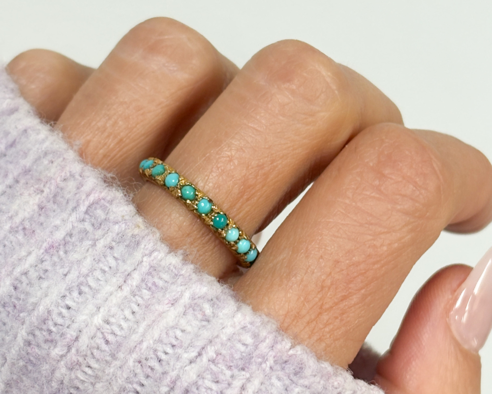 antique Victorian turquoise eternity ring for sale in Leeds, UK, shown on woman's finger