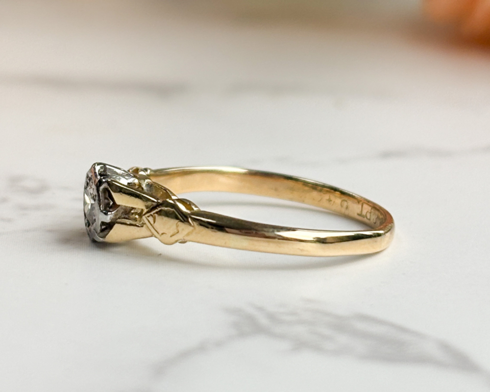 antique 1930s illusion set diamond solitaire ring in 18ct yellow gold and platinum for sale in Leeds, UK, showing side view of the ring