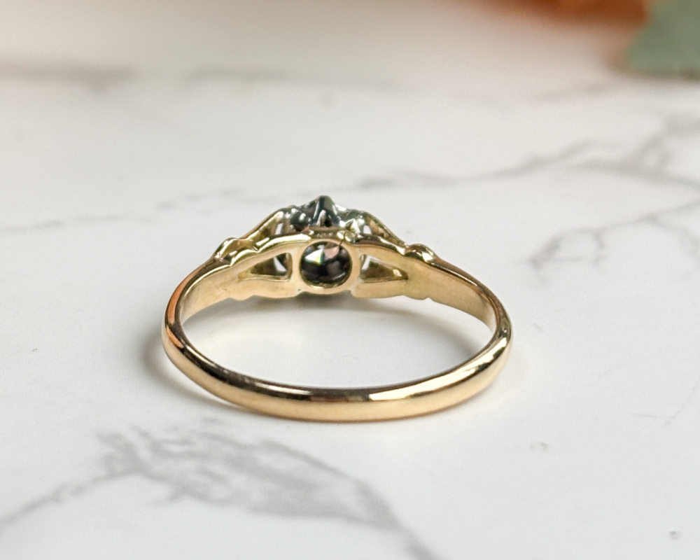 antique 1930s illusion set diamond solitaire ring in 18ct yellow gold and platinum for sale in Leeds, UK, showing back view of the ring