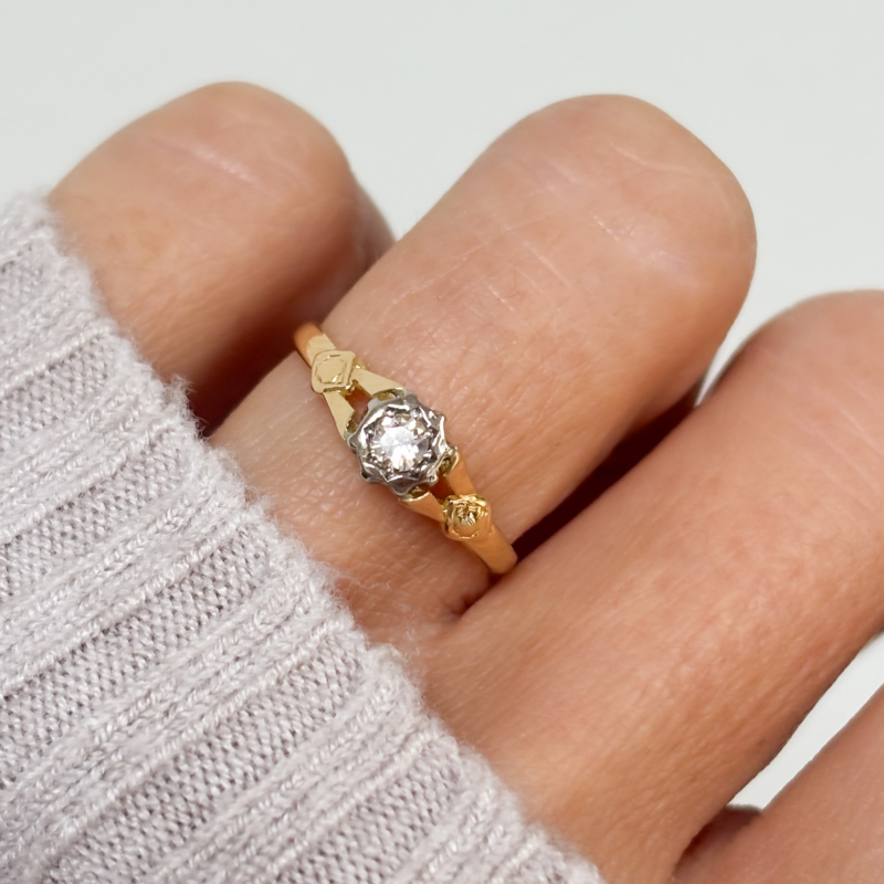 antique 1930s illusion set diamond solitaire ring in 18ct yellow gold and platinum for sale in Leeds, UK, shown on lady's finger