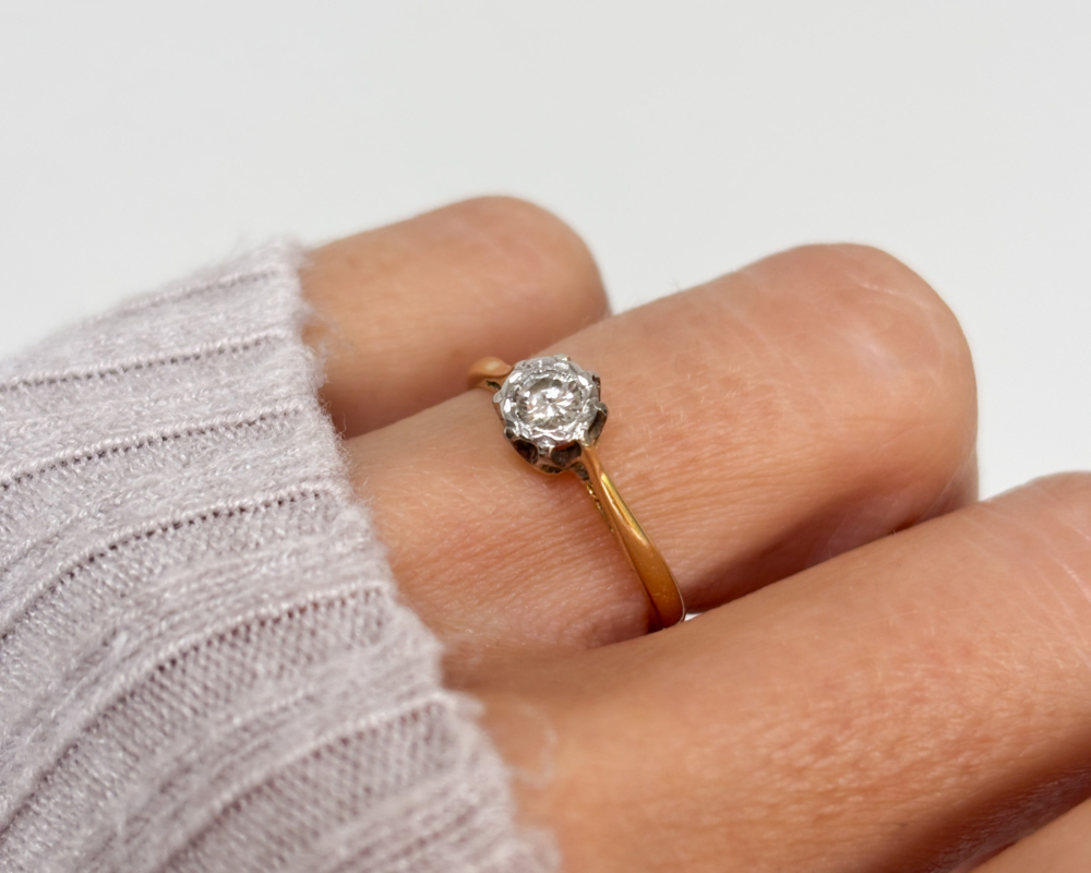 1930s illusion set diamond solitaire ring for sale in Leeds, UK, shown on woman's finger