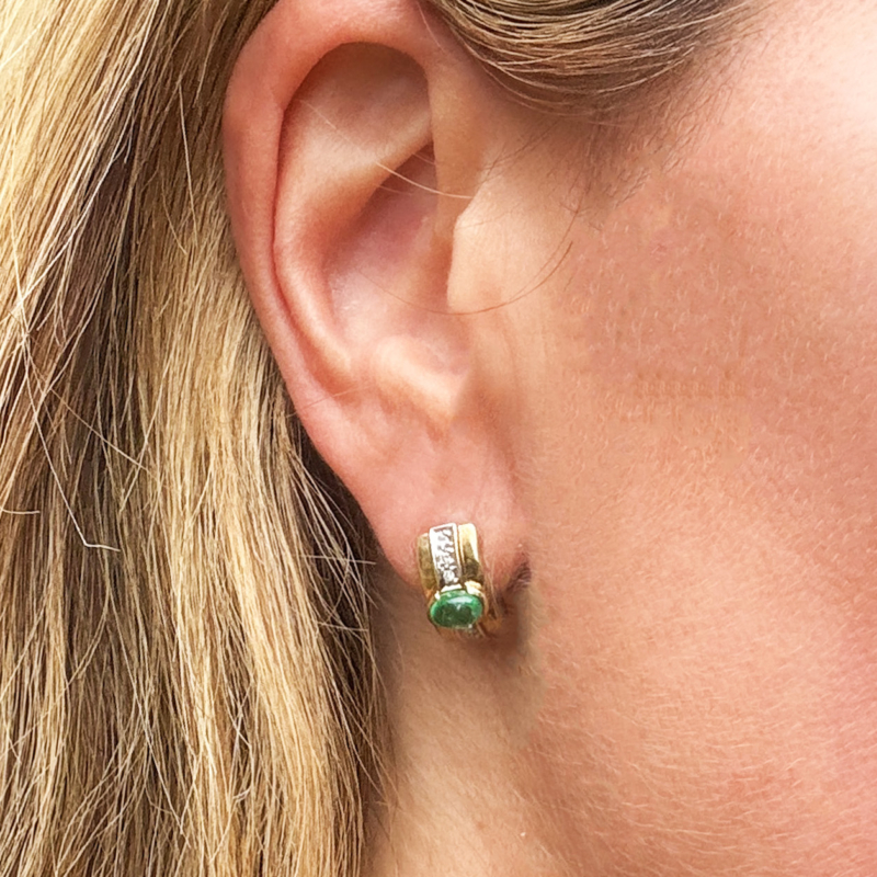 vintage emerald and diamond stud earrings for sale in Leeds, shown on woman's ear