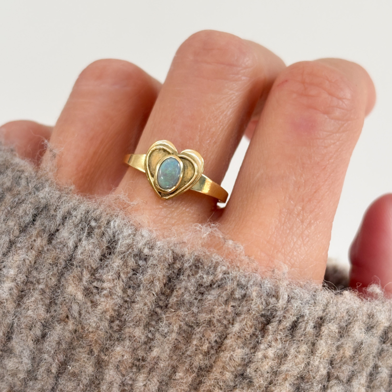 vintage opal heart shaped ring in 18ct gold for sale in Leeds, UK shown on woman's finger