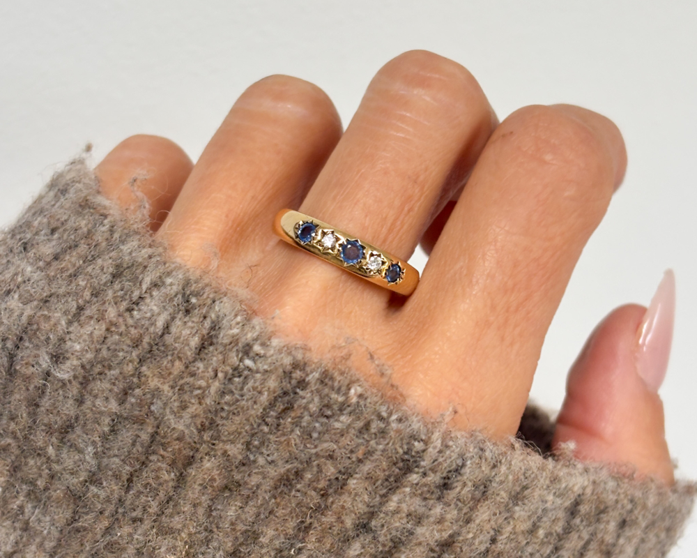 vintage sapphire and diamond ring with star setting in 9ct gold for sale in Leeds, UK shown on lady's hand