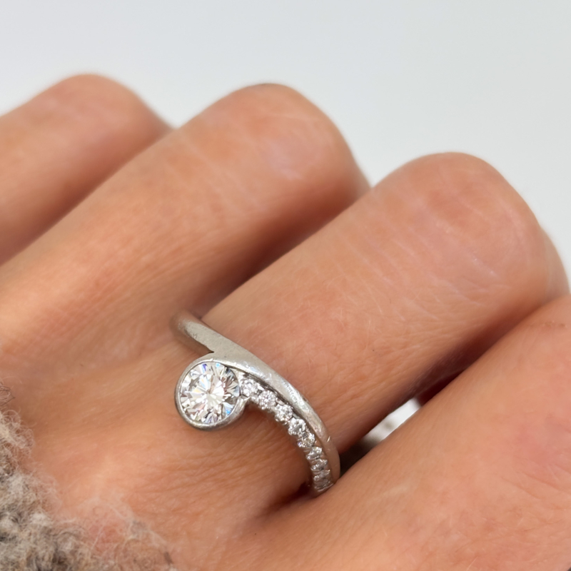 platinum and diamond twist ring for sale in Leeds, shown on woman's hand