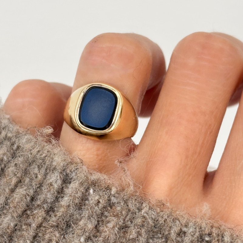 vintage onyx signet ring in 9ct gold hallmarks for 1974 for sale in Leeds, shown on woman's hand
