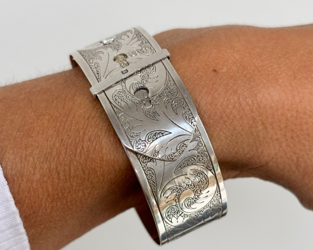 Charles Horner silver bangle with belt buckle design and hallmarks for Chester 1945. For sale in Leeds, shown on woman's wrist