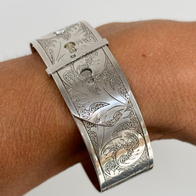 Charles Horner silver bangle with belt buckle design and hallmarks for Chester 1945. For sale in Leeds, shown on woman's wrist