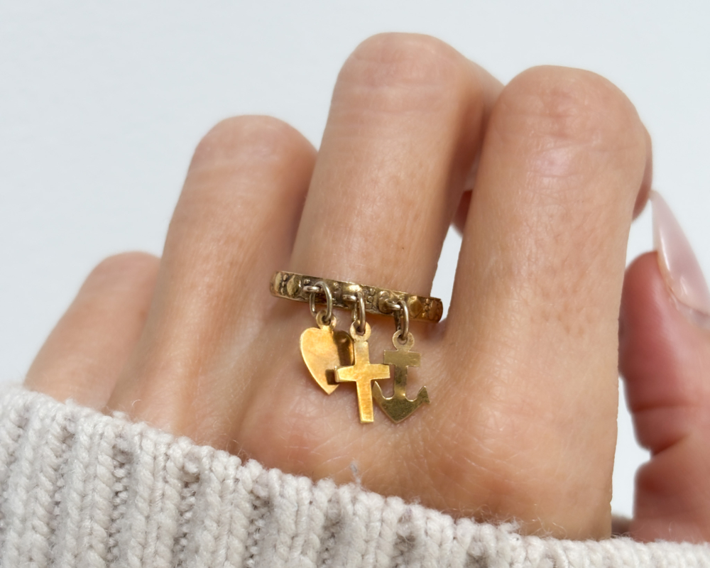 antique Victorian faith, hope and charity ring in 9ct gold for sale in Leeds, UK, shown on lady's finger