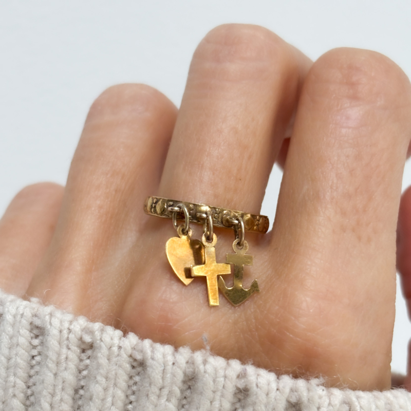 antique Victorian faith, hope and charity ring in 9ct gold for sale in Leeds, UK, shown on lady's finger