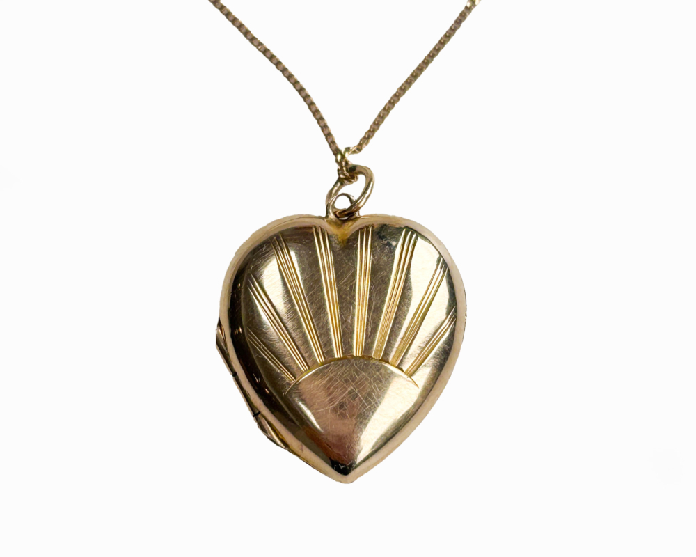 vintage gold sunburst heart locket and chain for sale in Leeds
