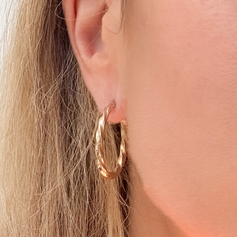 vintage 9ct gold hoops with woven effect design. For sale in Leeds, Yorkshire, shown in woman's ear