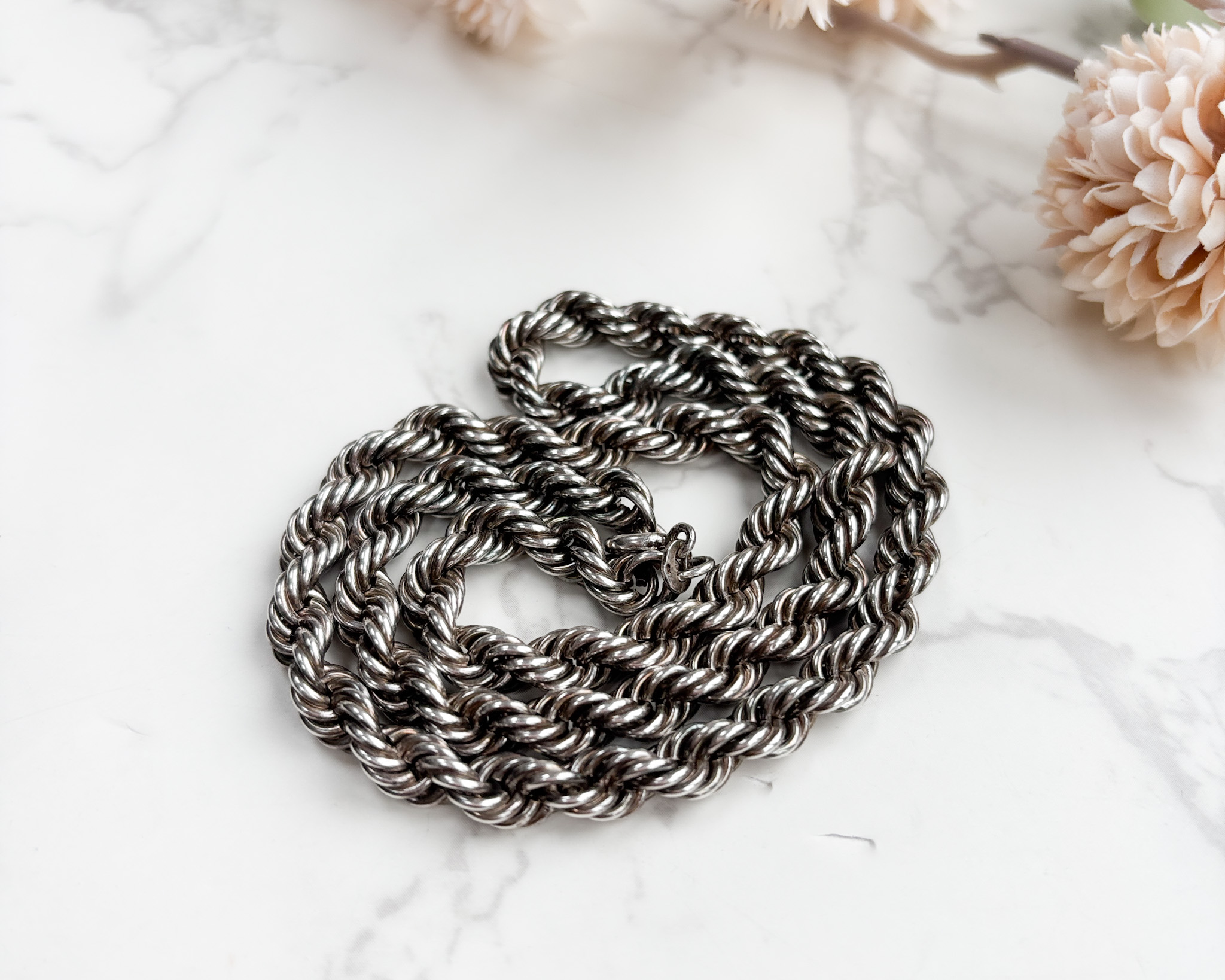 silver rope chain curled up