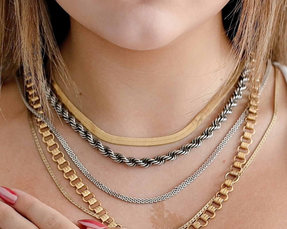 woman wearing lots of layering chains