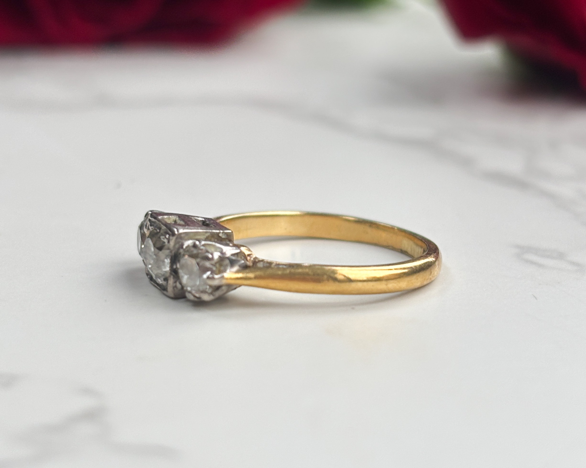 side view three stone diamond ring