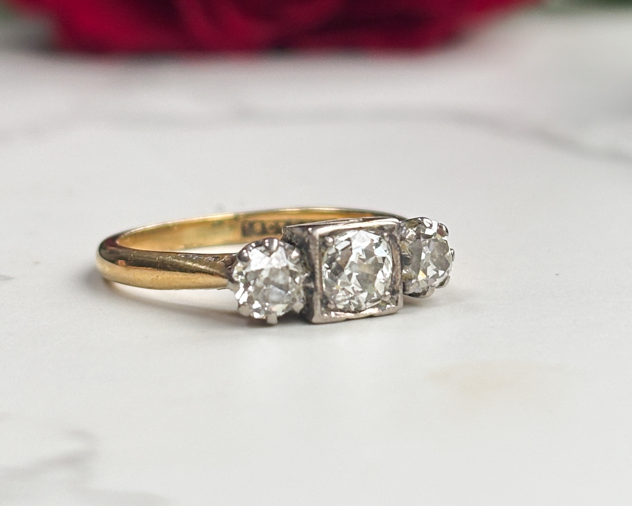 side profile three stone diamond ring