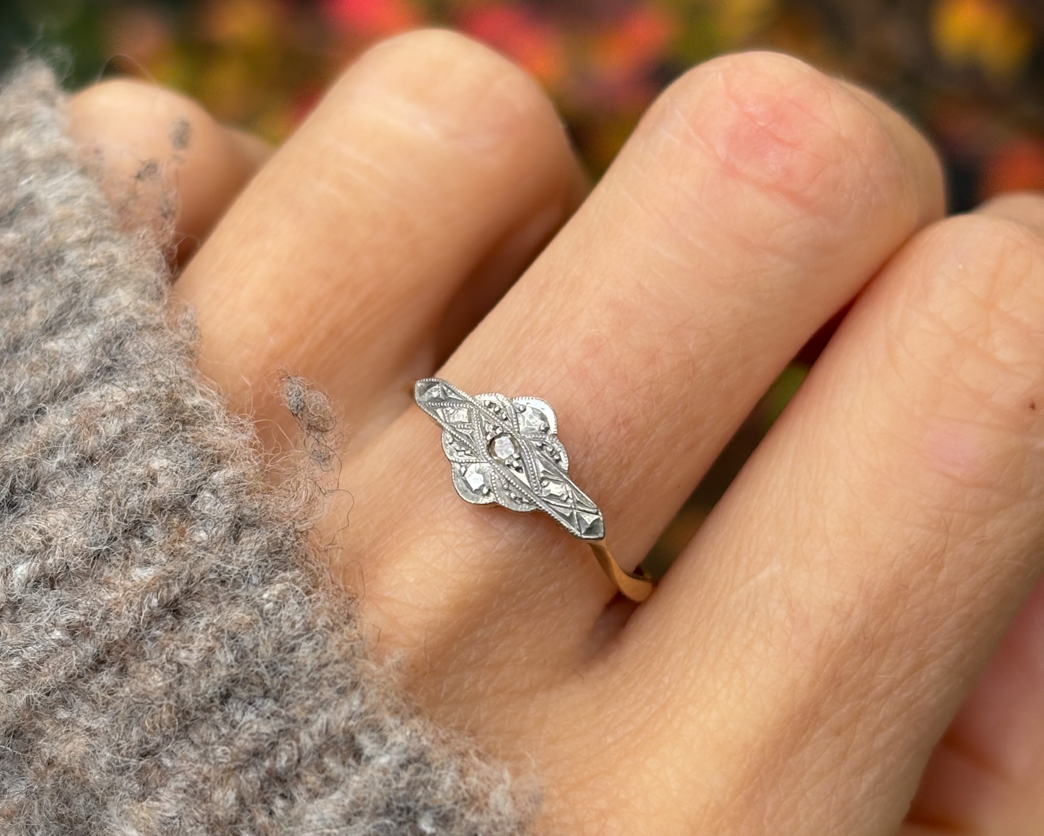 woman wearing art deco panel ring