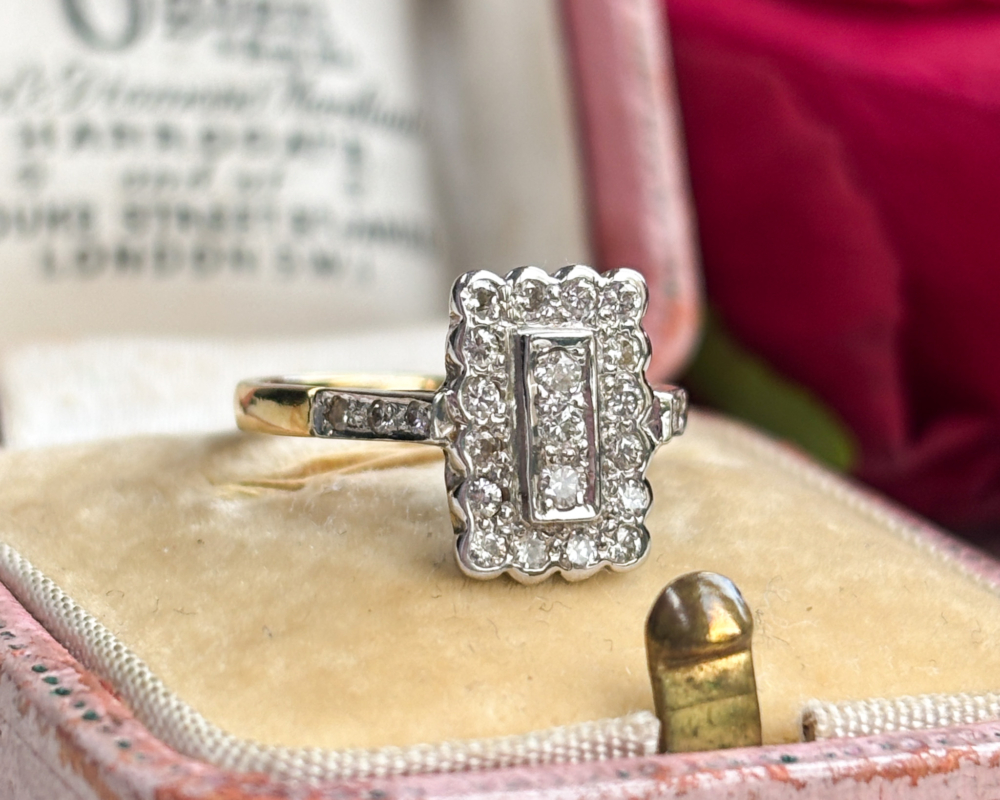 vintage style diamond panel ring in 18ct gold for sale in Leeds, shown on top of an antique box