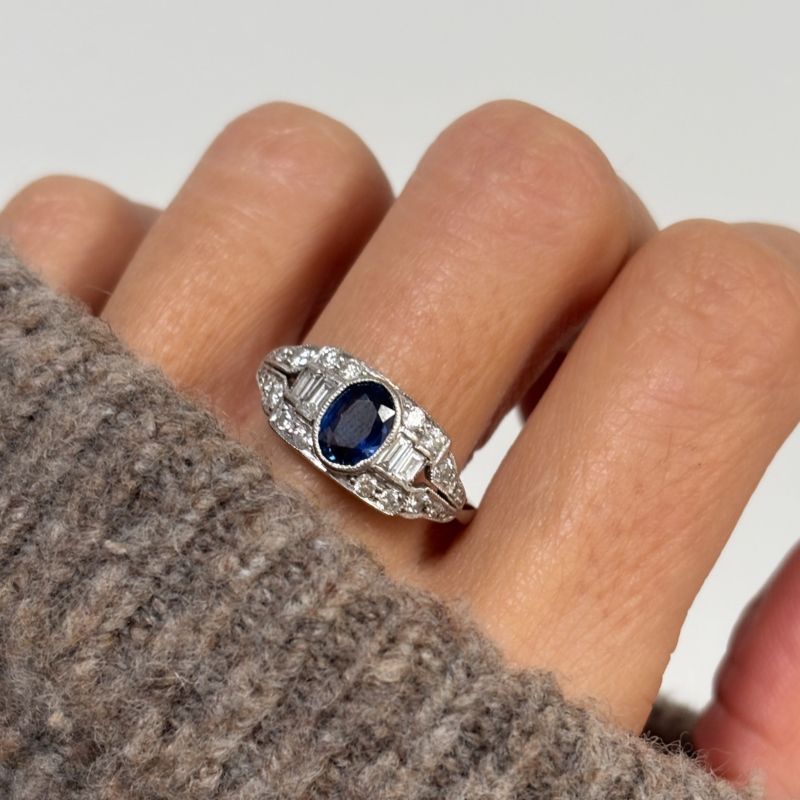 antique Art Deco sapphire and diamond ring with baguette diamonds in 18ct white gold for sale in Leeds, UK, shown on lady's finger