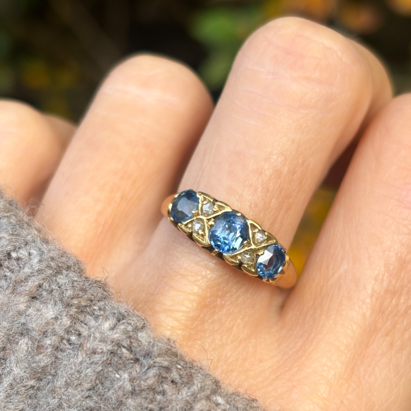 antique Edwardian sapphire and diamond in 18ct yellow gold for sale in Leeds, UK, shown on lady's finger