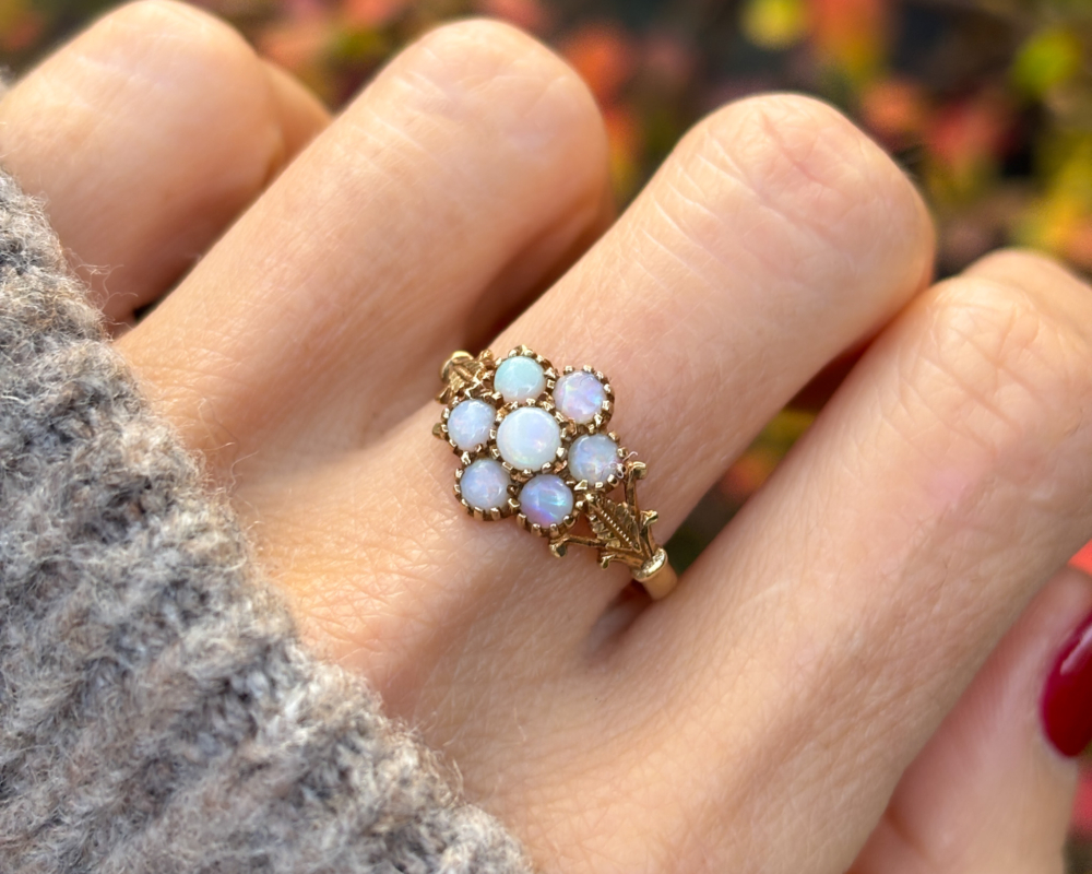 vintage opal cluster ring in 9ct gold for sale in Leeds, shown on lady's finger