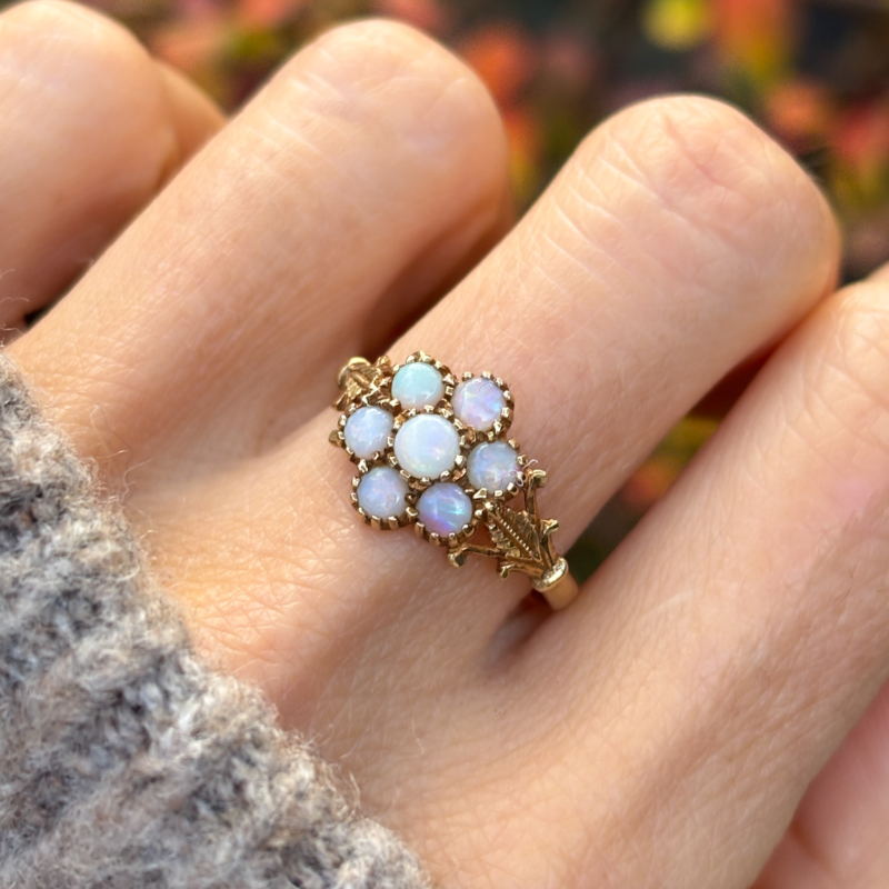 vintage opal cluster ring in 9ct gold for sale in Leeds, shown on lady's finger