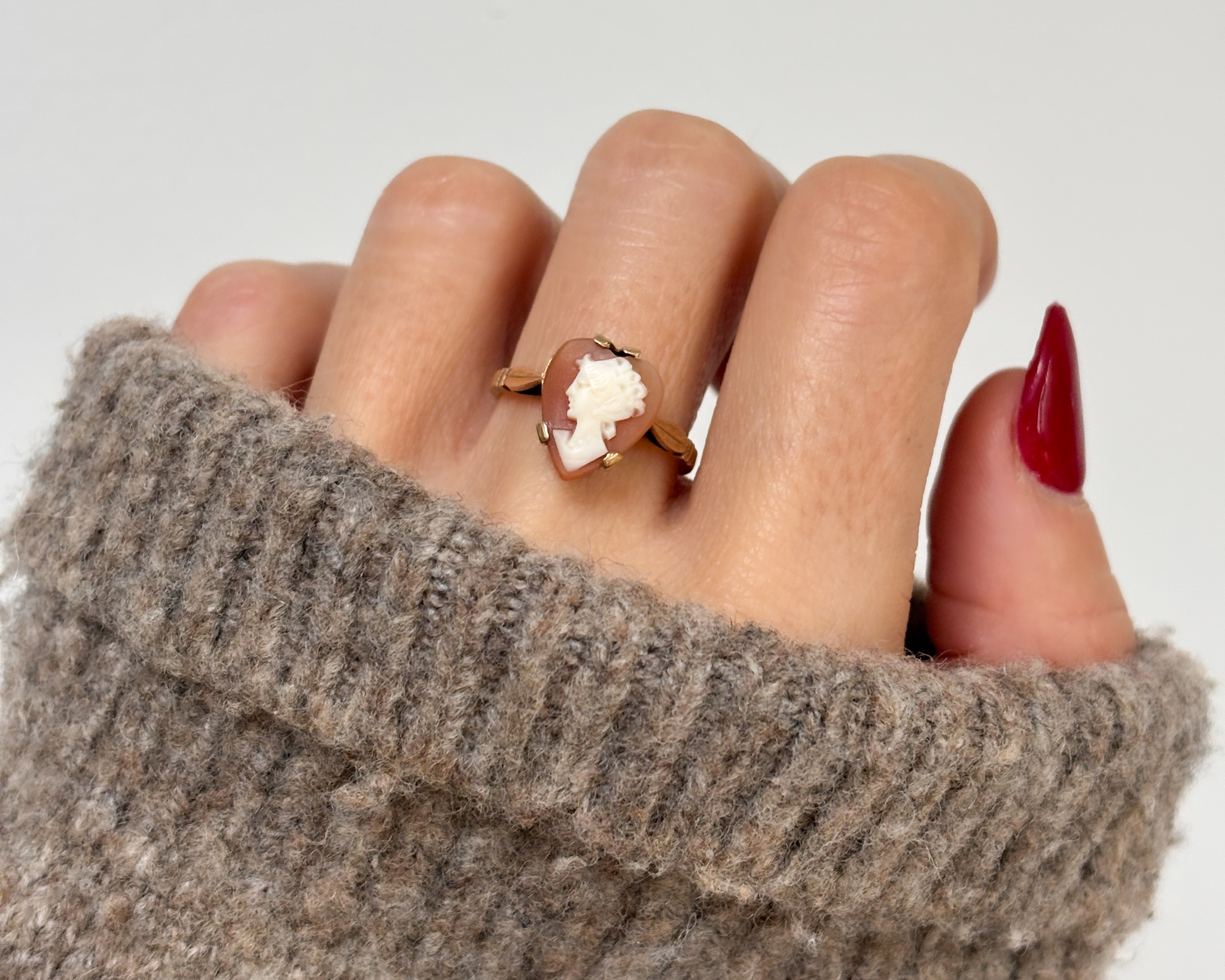 vintage heart cameo ring on hand