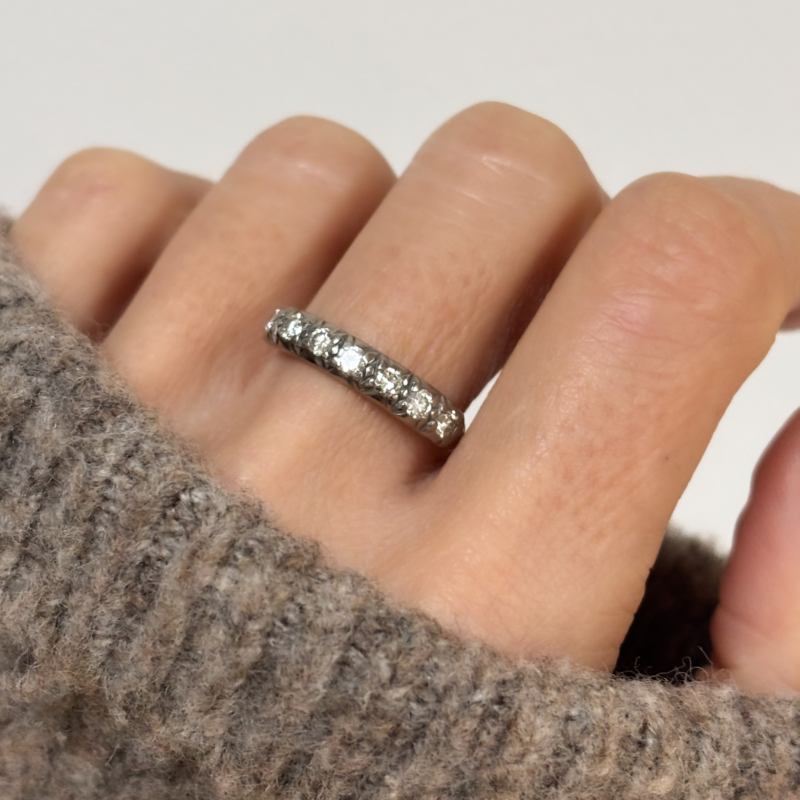1940s diamond half eternity ring in box for sale in Leeds, UK shown on woman's hand