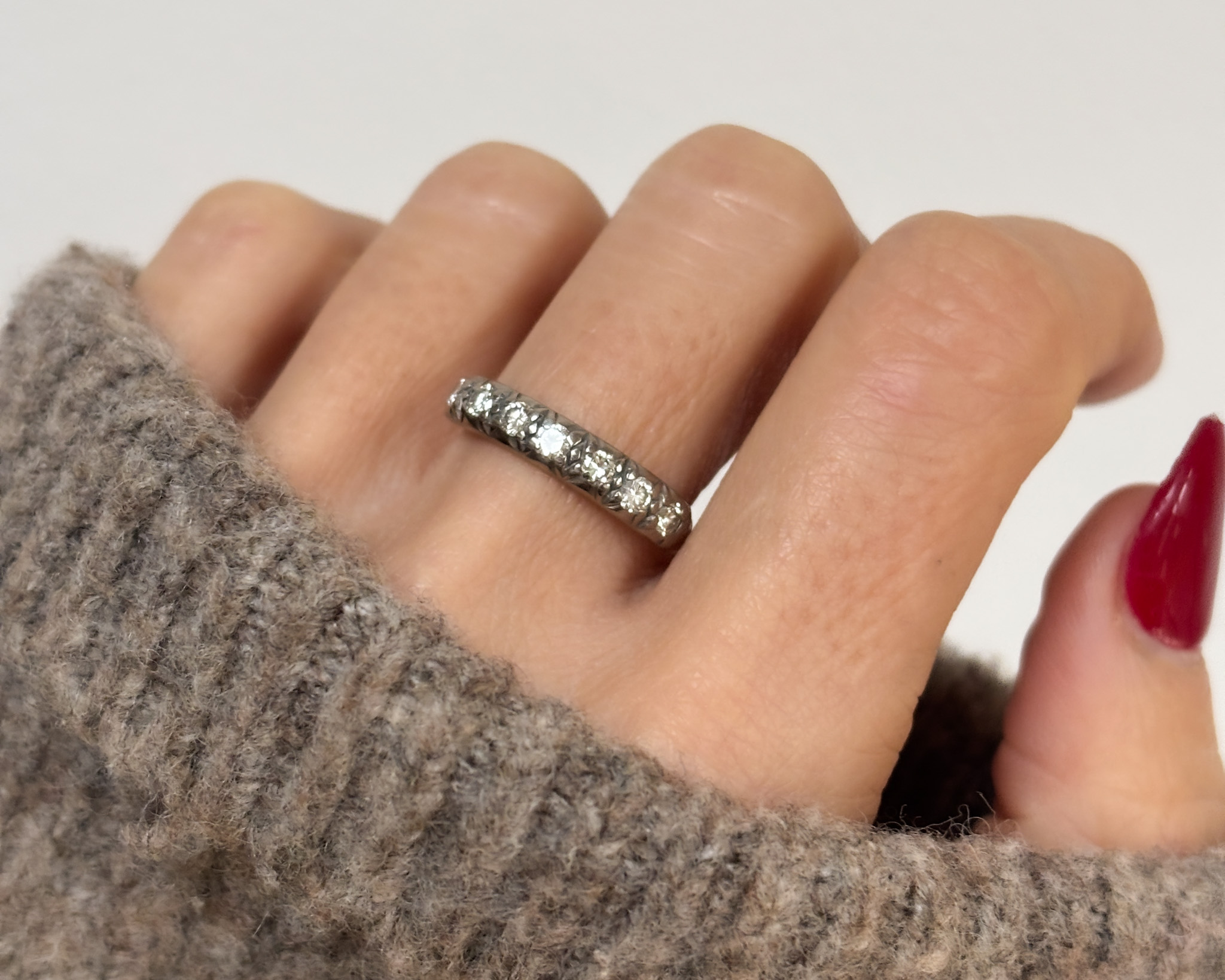 woman wearing 1940s diamond half eternity ring