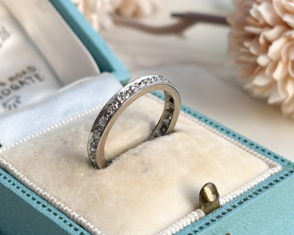 antique Art Deco diamond full eternity ring in platinum for sale, shown in blue box
