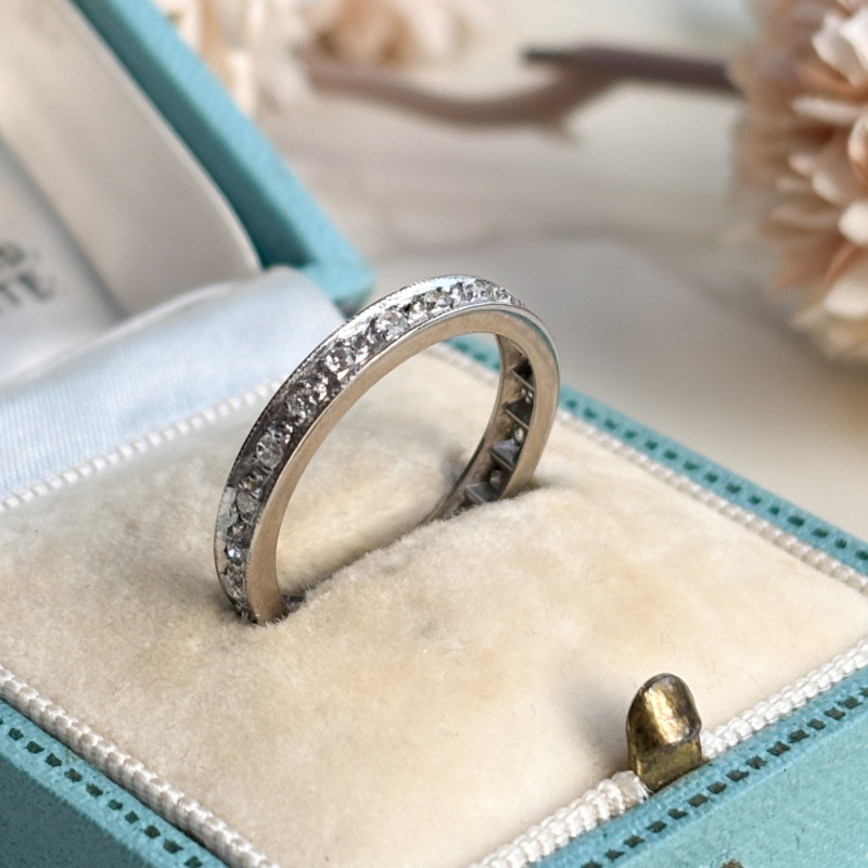 antique Art Deco diamond full eternity ring in platinum for sale, shown in blue box
