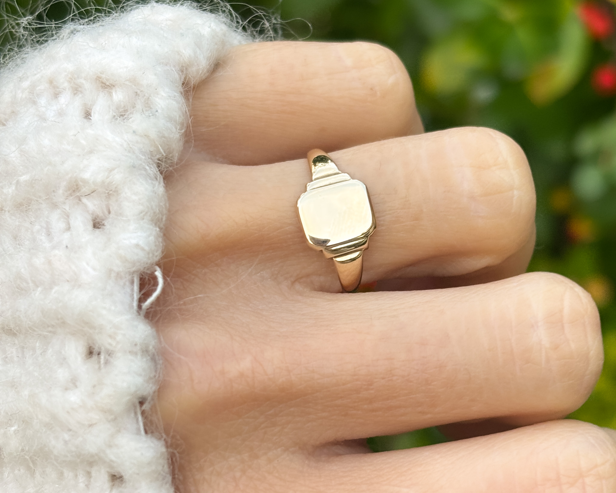 woman wearing signet ring