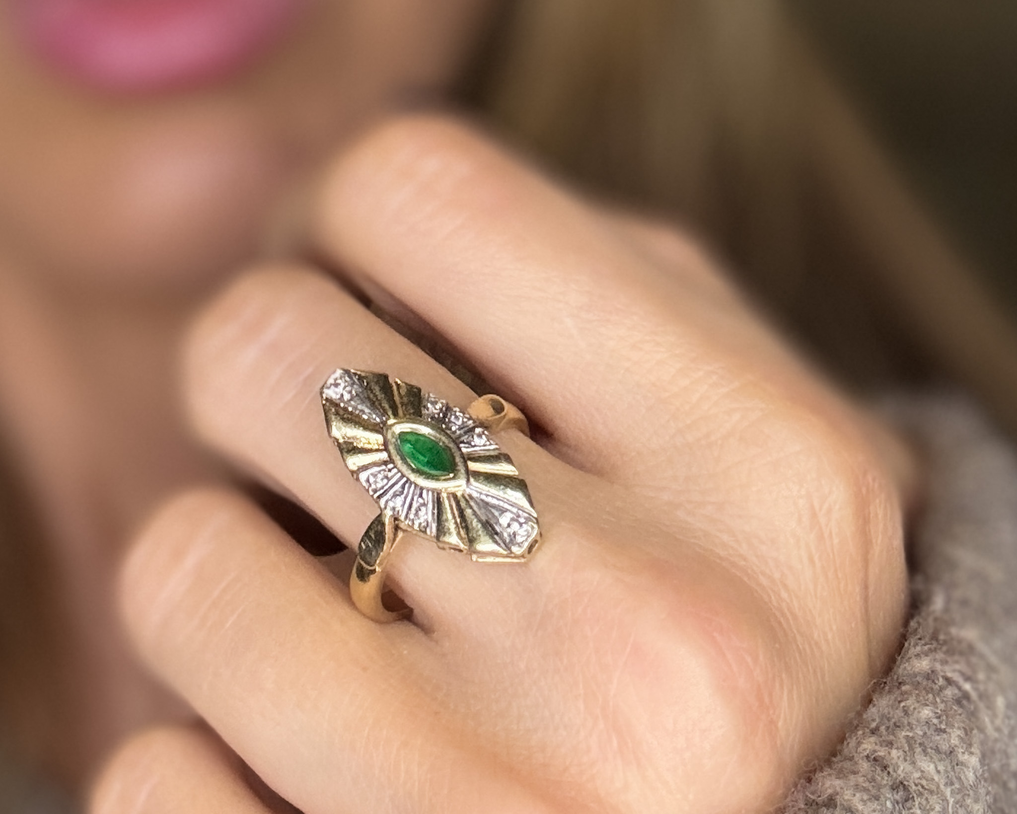 woman wearing emerald ring