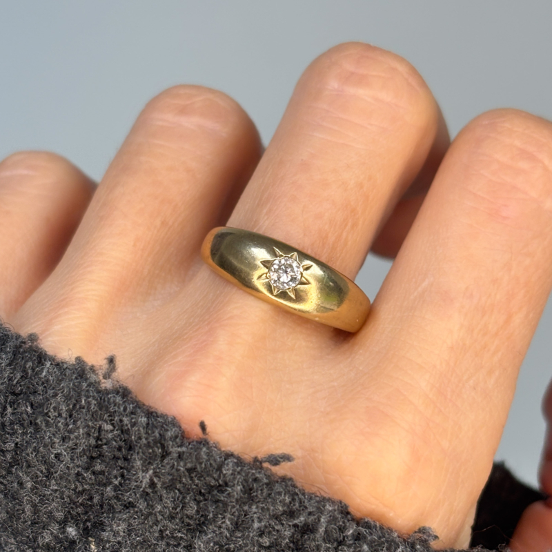 vintage diamond band in 9ct gold. star set diamond, shown on woman's finger