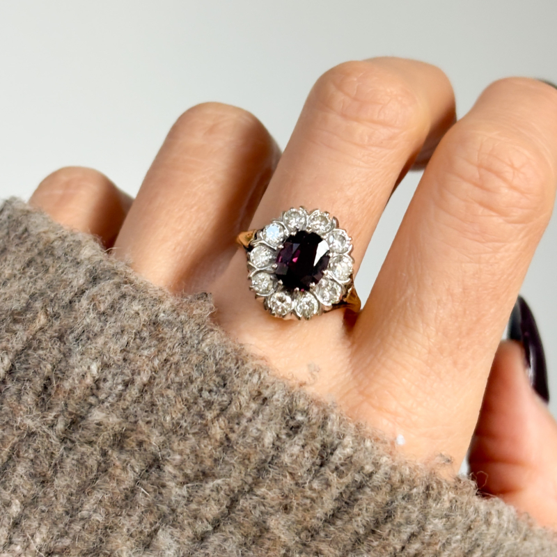 antique 1940s ruby and diamond cluster ring in 18ct gold for sale in Leeds, UK, shown on woman's hand