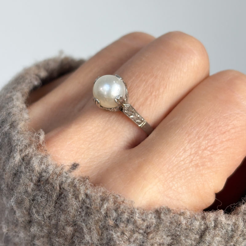 mid century pearl and platinum ring on woman's finger for sale