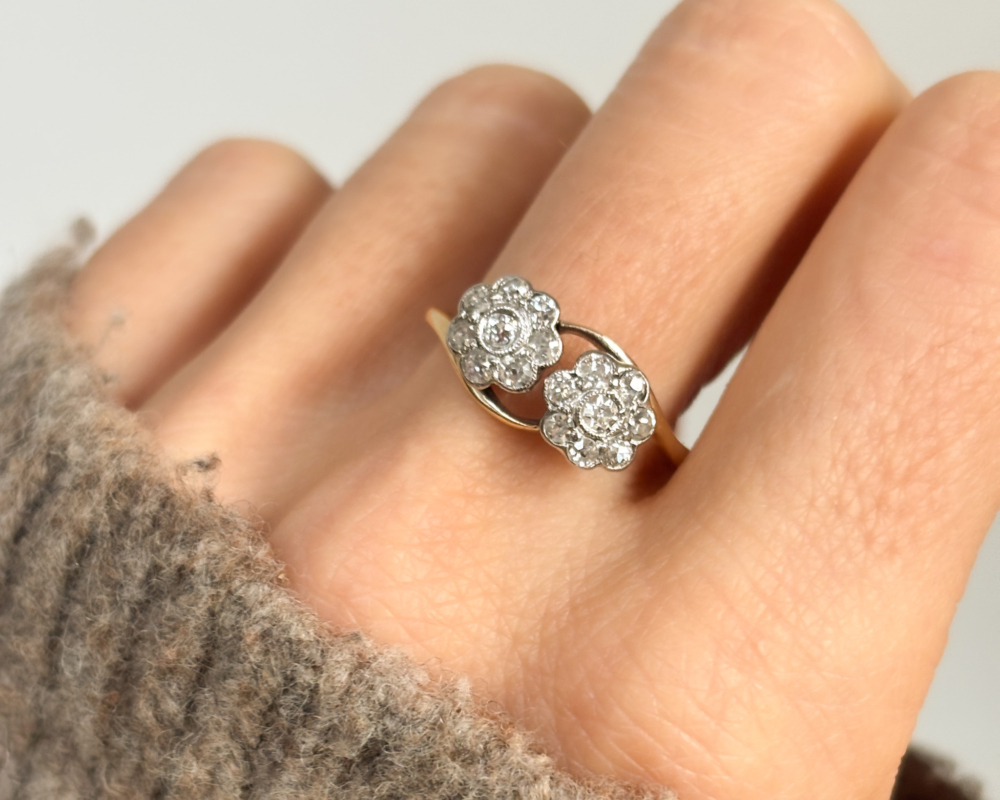 art deco double diamond ring in 18ct yellow gold and platinum on woman's hand