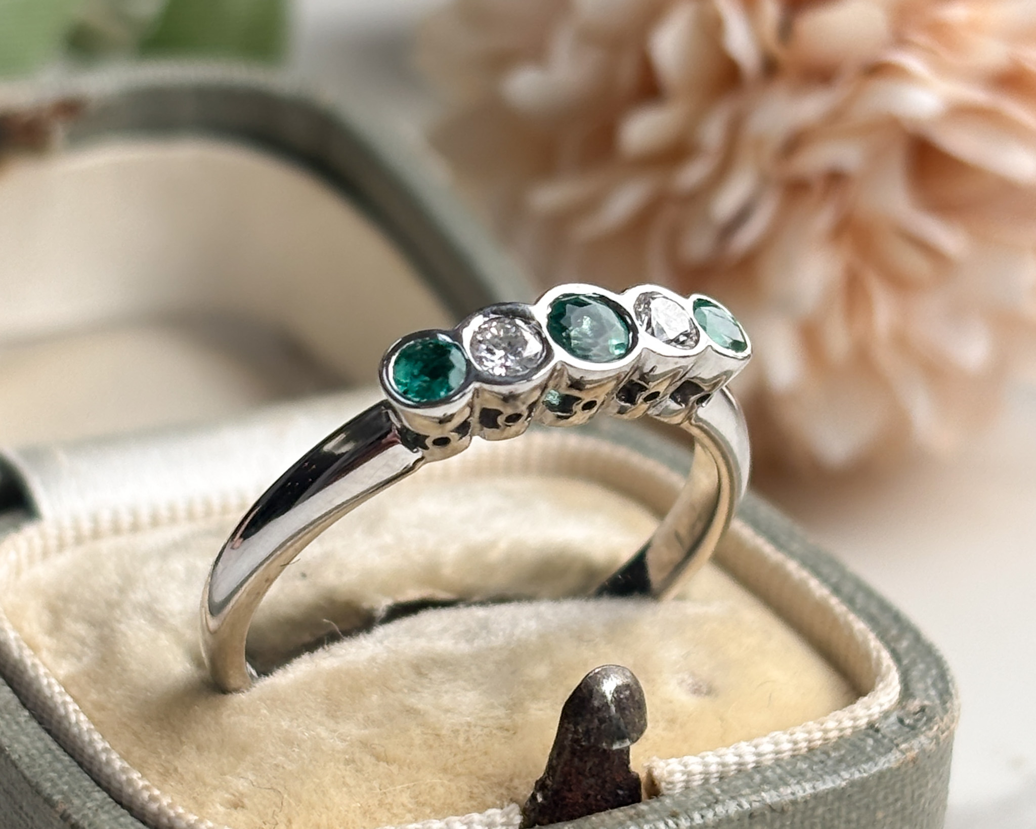 emerald and diamond ring in box