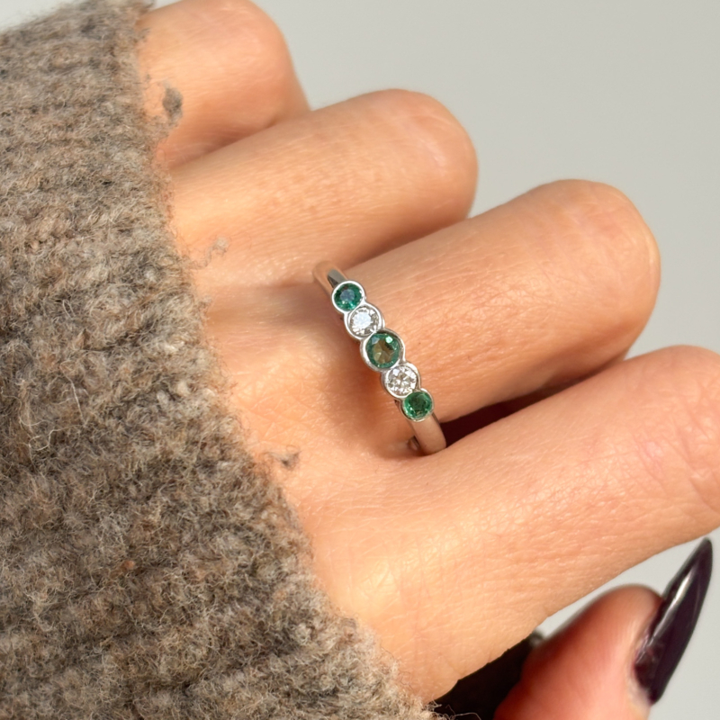 vintage emerald and diamond five stone ring in 18ct white gold for sale on woman's finger