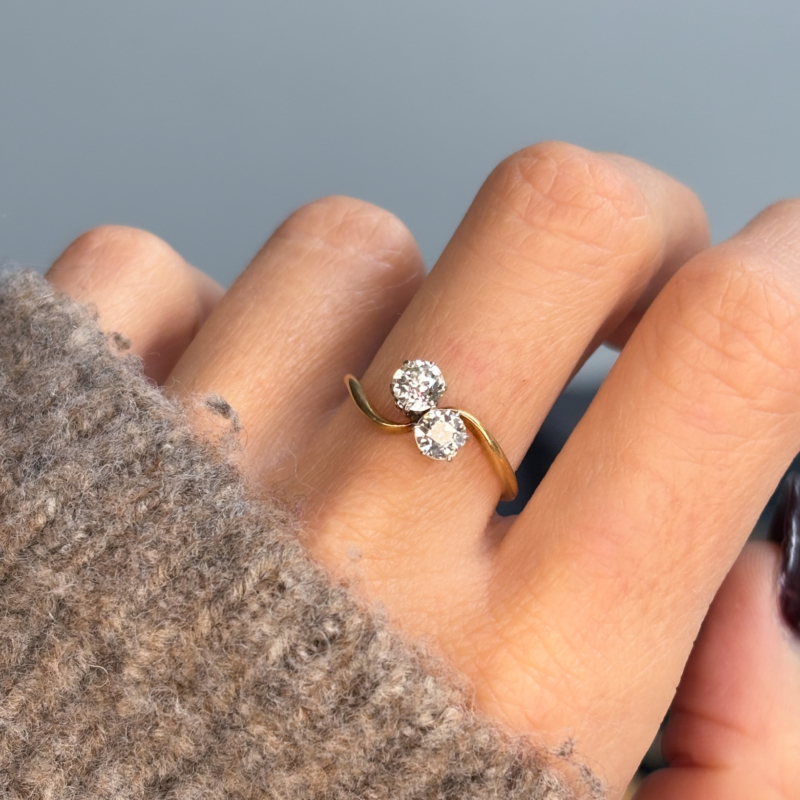 antique Edwardian diamond toi et moi ring in 18ct yellow gold for sale in Leeds, shown on woman's hand