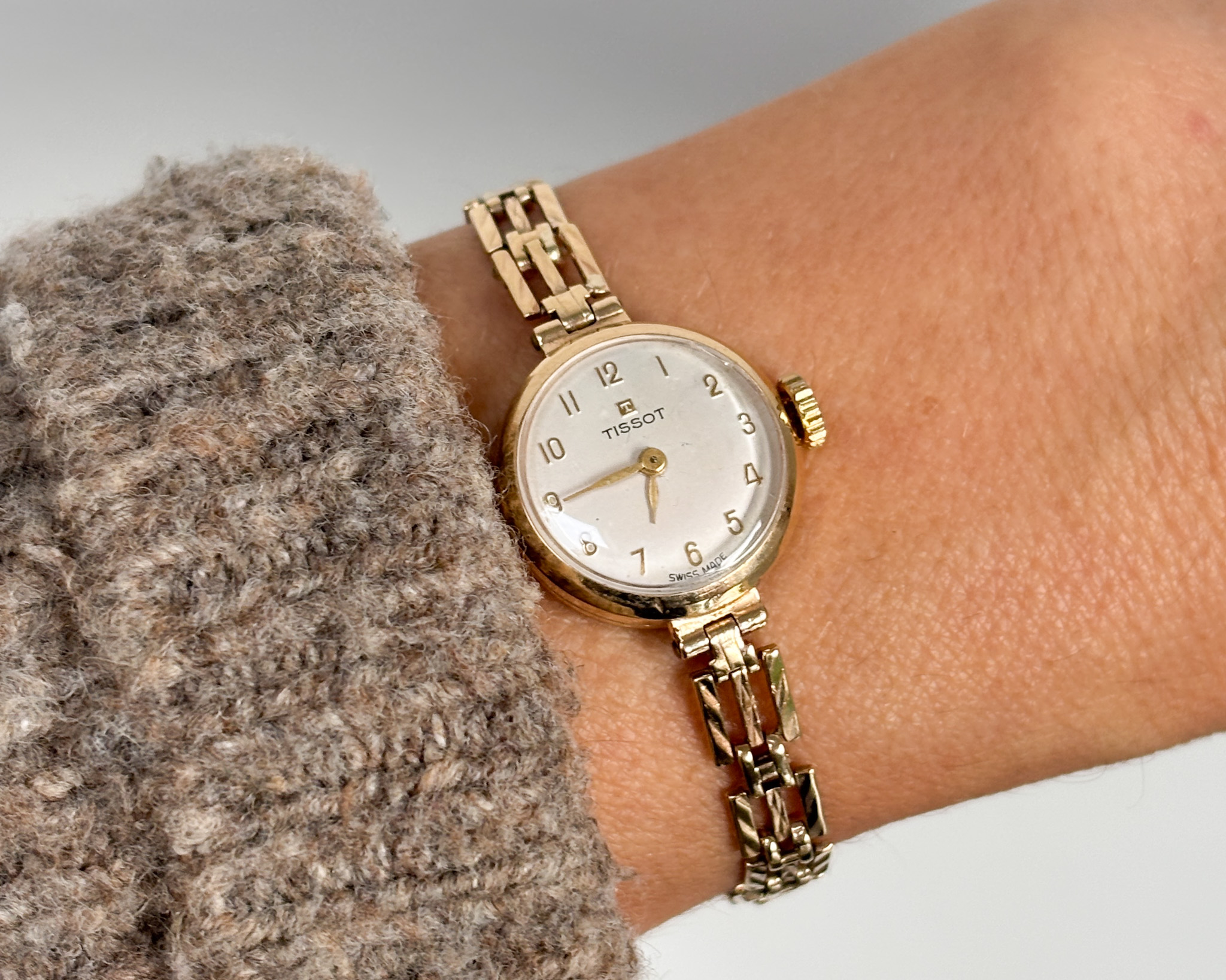 woman wearing Tissot watch