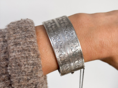 Victorian silver bangle with engraving on woman's wrist