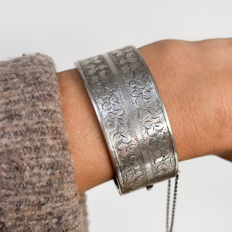 Victorian silver bangle with engraving on woman's wrist