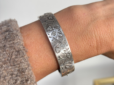 antique Victorian silver bangle for sale in Leeds shown on a woman's wrist