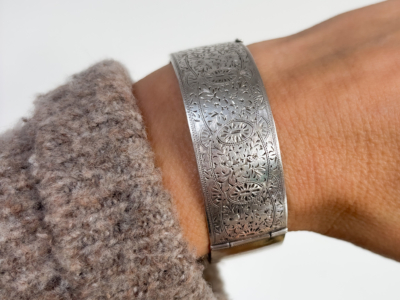 Antique Charles Horner silver bangle dated 1937 shown on woman's wrist