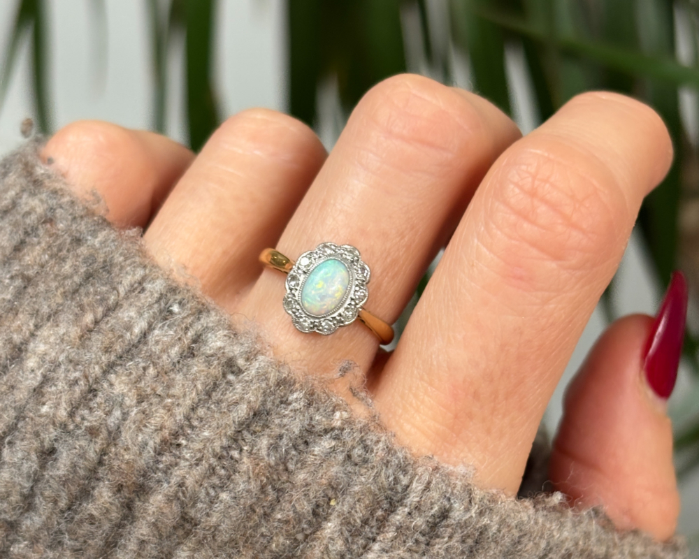 antique opal and diamond cluster ring circa 1920s for sale in Leeds. Shown on lady's hand