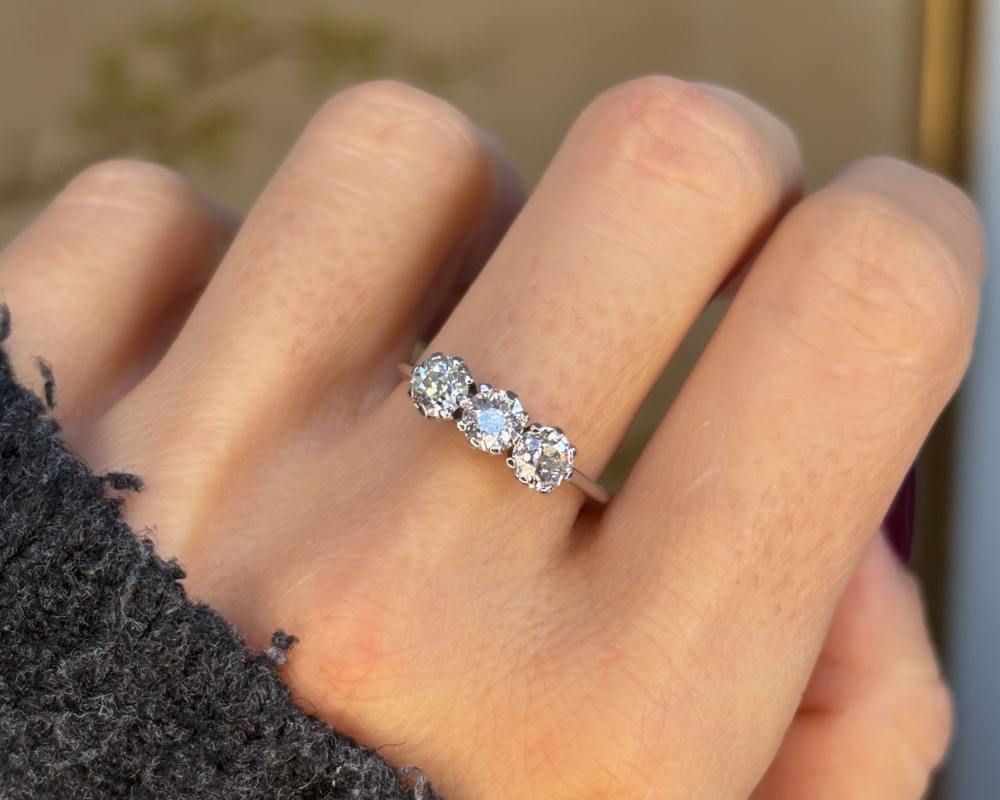 antique Edwardian three stone diamond ring in 18ct white gold and platinum. for sale in Leeds, UK, shown on a woman's hand